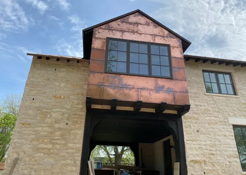Copper metal panel facade on a stone building for Skylight Installation in Coxsackie